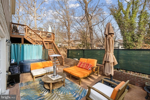 view of patio / terrace featuring a wooden deck and an outdoor living space