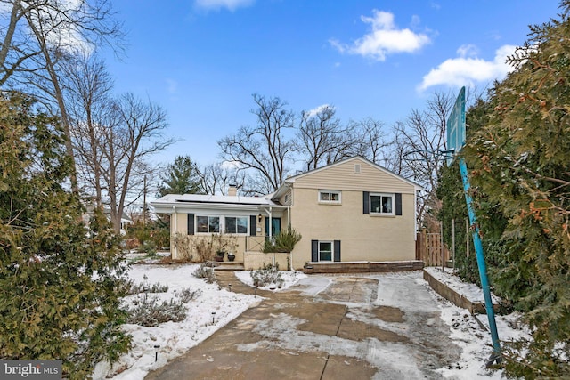 view of snow covered house