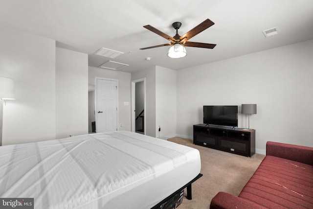 bedroom featuring light colored carpet and ceiling fan