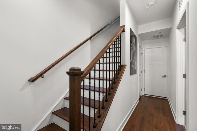 stairway with wood-type flooring