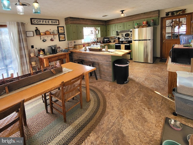 dining area featuring a textured ceiling