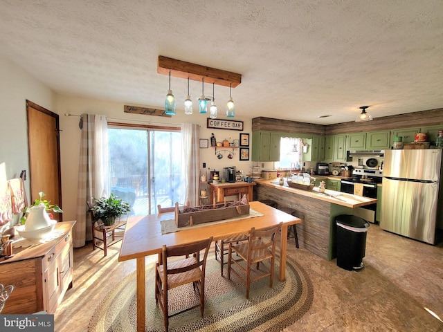 dining room with sink and a textured ceiling