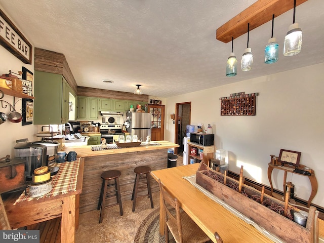 dining room featuring sink and a textured ceiling