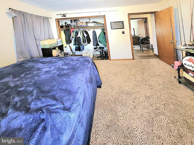 bedroom featuring a textured ceiling and a closet