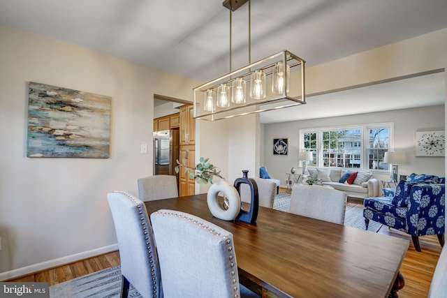 dining space featuring hardwood / wood-style flooring