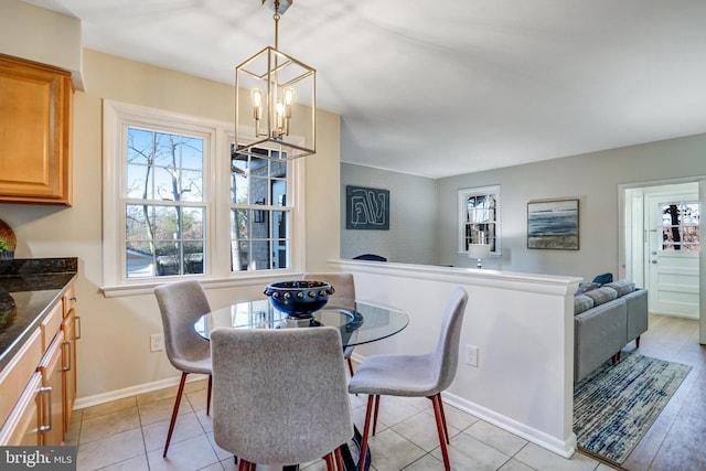 dining area with an inviting chandelier