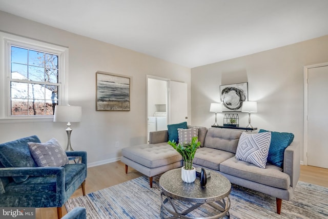 living room featuring hardwood / wood-style floors and washer and clothes dryer