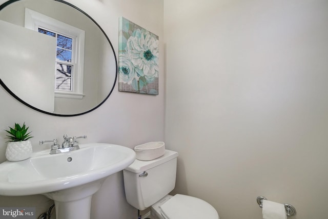 bathroom with sink and toilet