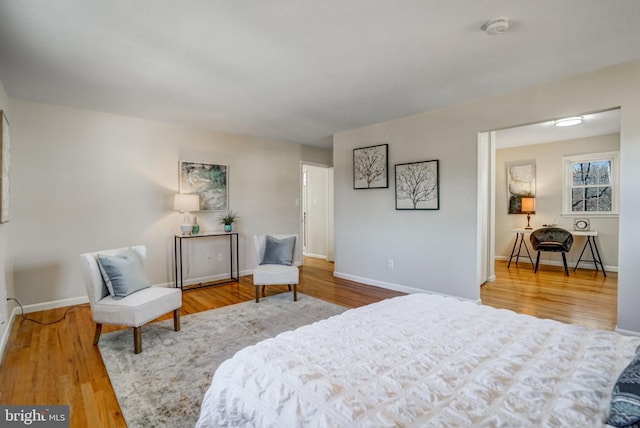 bedroom with hardwood / wood-style floors