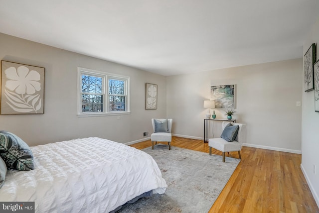 bedroom with hardwood / wood-style flooring