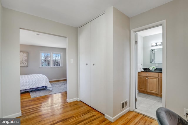 hall featuring light hardwood / wood-style flooring