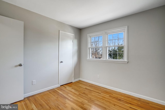 unfurnished bedroom featuring light wood-type flooring