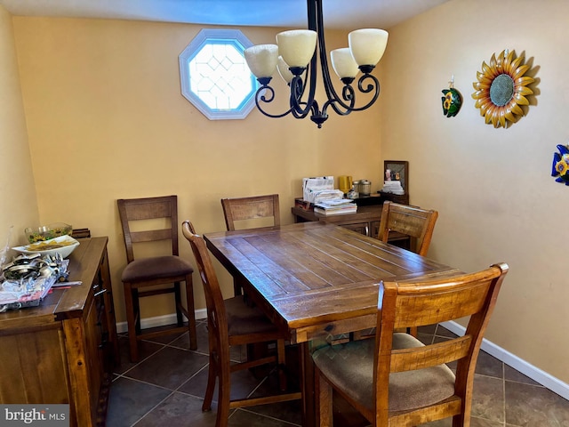 tiled dining space with an inviting chandelier