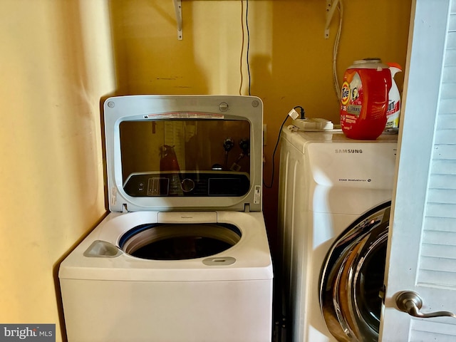 washroom with separate washer and dryer