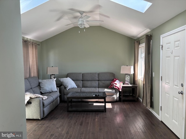 living room with ceiling fan, dark hardwood / wood-style floors, and vaulted ceiling with skylight