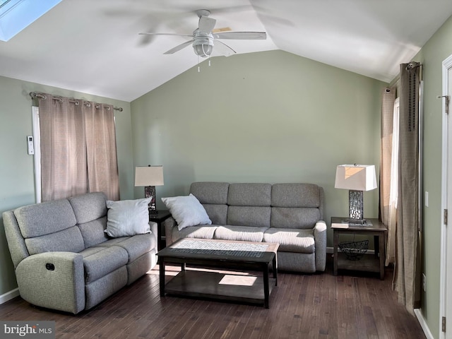 living room featuring dark wood-type flooring, ceiling fan, and vaulted ceiling