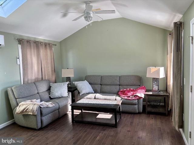 living room with dark wood-type flooring, lofted ceiling with skylight, and ceiling fan