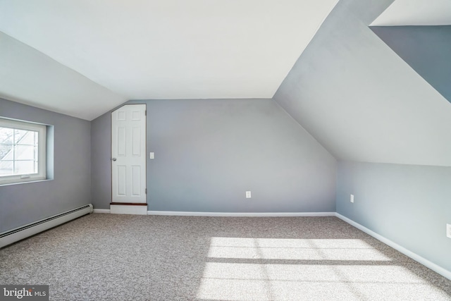 bonus room featuring light colored carpet, baseboard heating, and vaulted ceiling