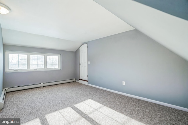 bonus room featuring carpet, vaulted ceiling, and a baseboard heating unit