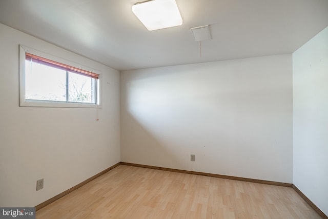 spare room featuring light wood-type flooring