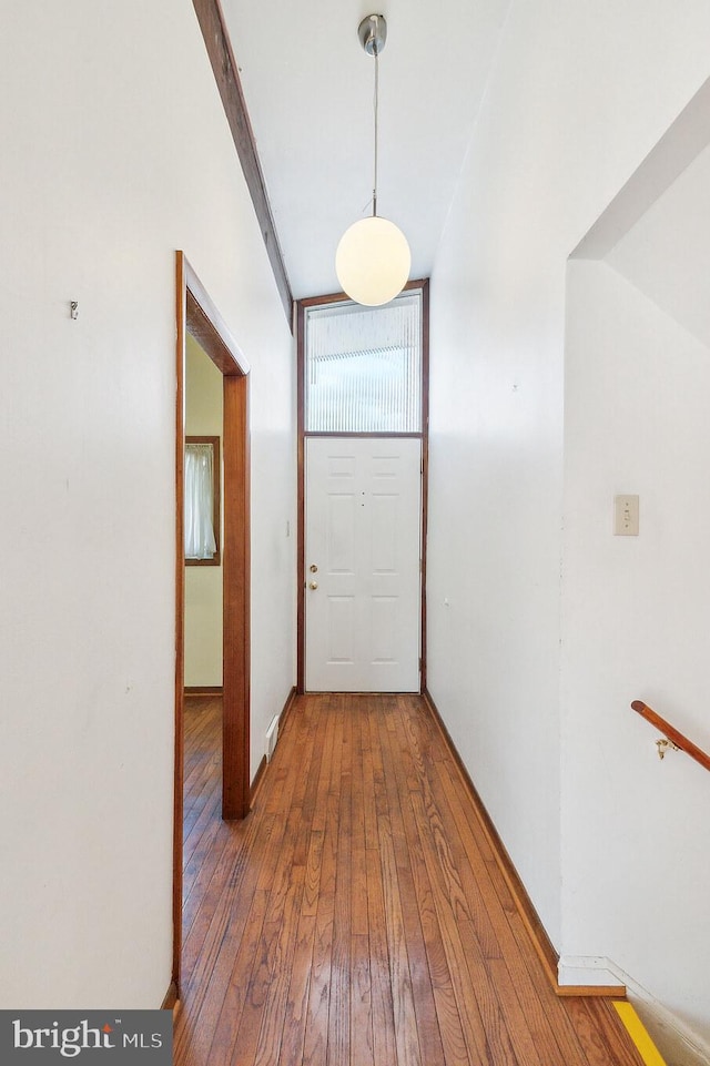 corridor with wood-type flooring