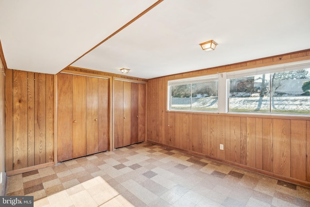 bonus room with wood walls