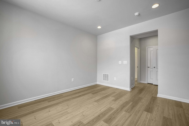 unfurnished room with light hardwood / wood-style floors