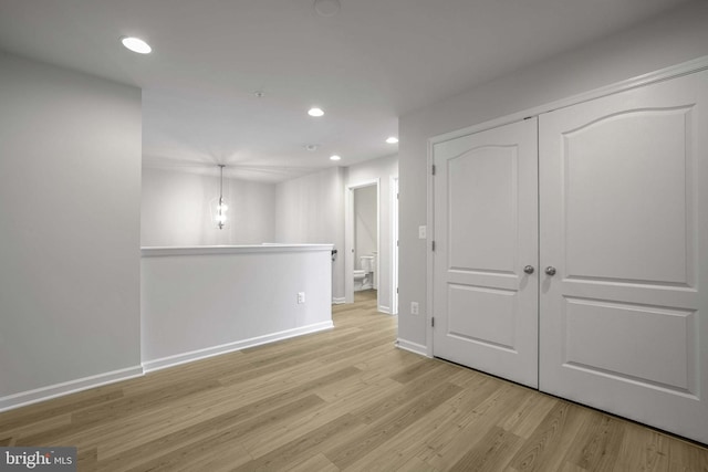 spare room featuring light hardwood / wood-style floors