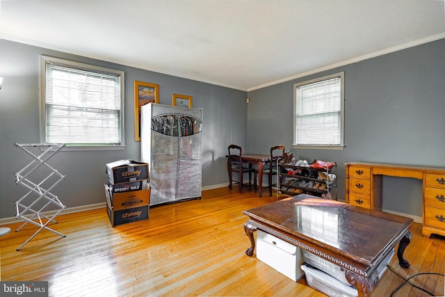 living room featuring light hardwood / wood-style flooring and ornamental molding