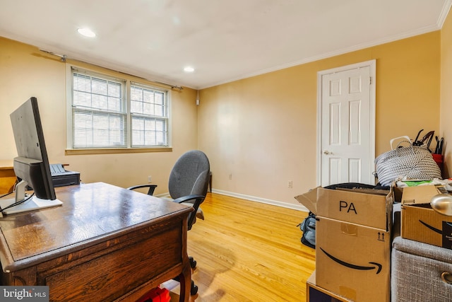 office featuring light hardwood / wood-style floors and crown molding