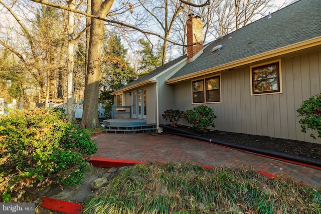 exterior space with a patio area and a wooden deck