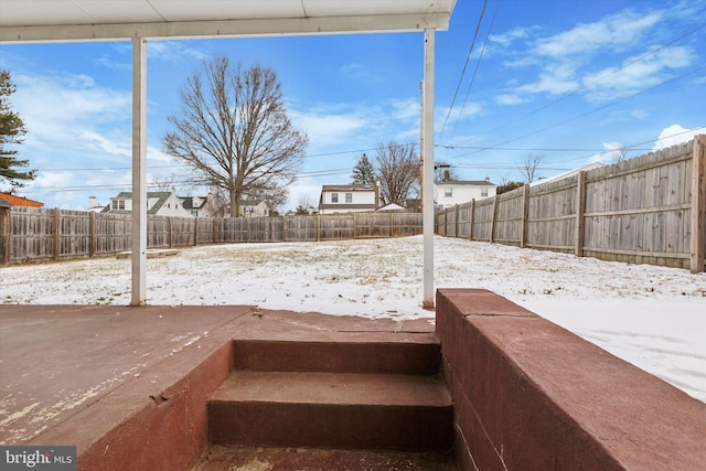 view of yard covered in snow