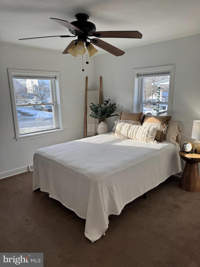 carpeted bedroom with ceiling fan