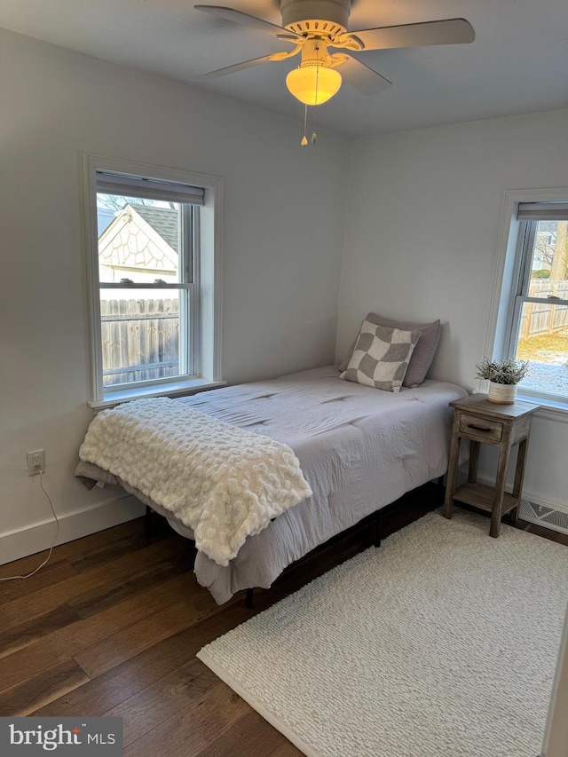 bedroom with ceiling fan and wood-type flooring