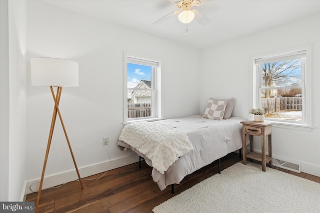 bedroom featuring ceiling fan and dark hardwood / wood-style flooring