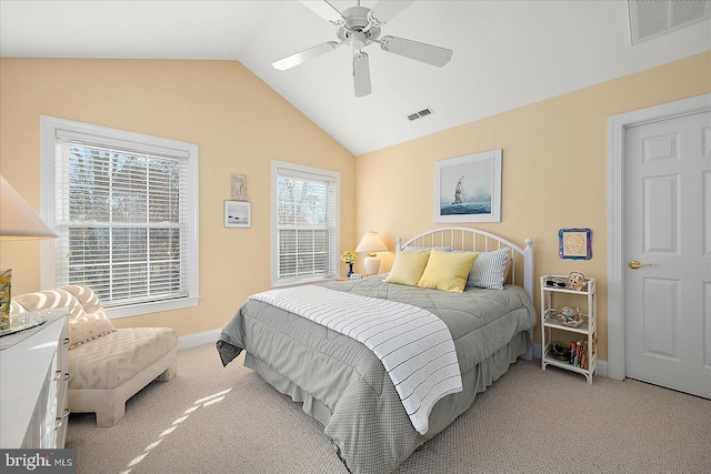 bedroom with ceiling fan, light carpet, and lofted ceiling