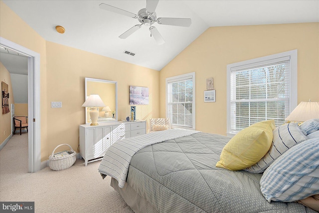 carpeted bedroom featuring ceiling fan and vaulted ceiling