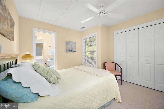 carpeted bedroom with ceiling fan and a closet