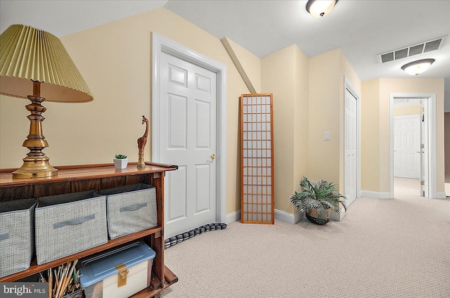 view of carpeted entrance foyer