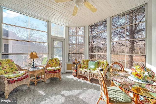 sunroom / solarium with ceiling fan and wood ceiling