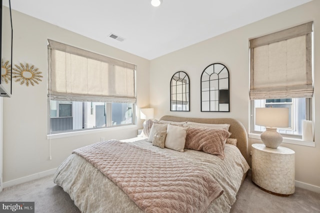 bedroom featuring light colored carpet