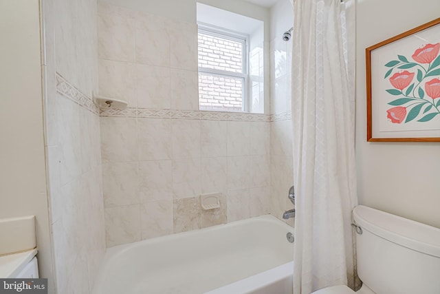 bathroom featuring toilet and shower / bathtub combination with curtain
