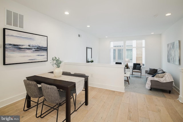 dining space featuring light hardwood / wood-style floors