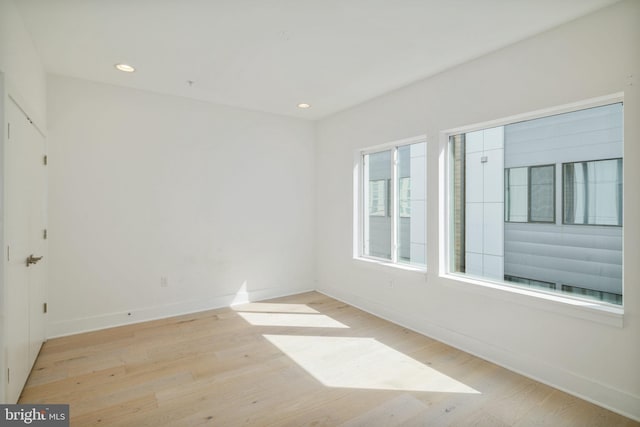 empty room with light hardwood / wood-style floors