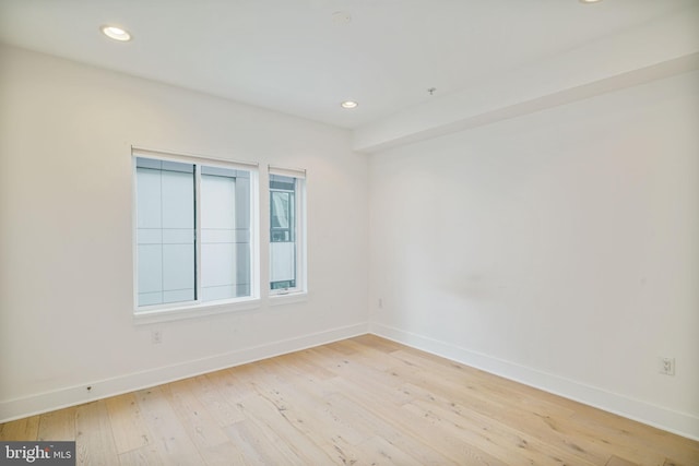 spare room with light wood-type flooring