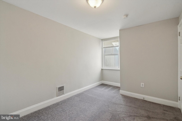 unfurnished room featuring carpet flooring