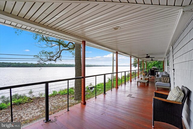 deck featuring a water view