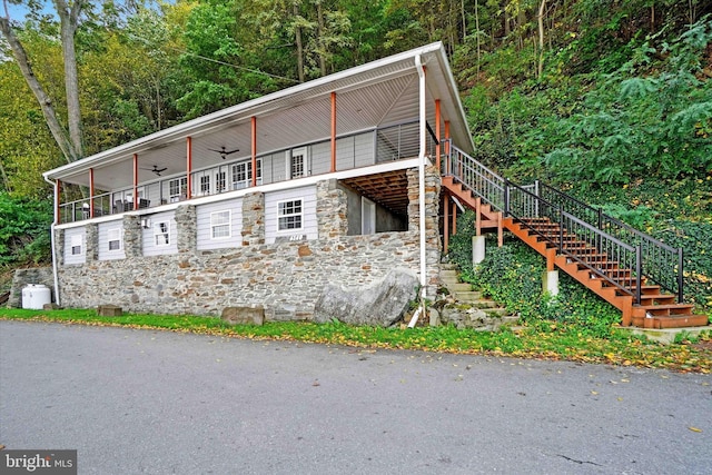 view of property exterior with ceiling fan