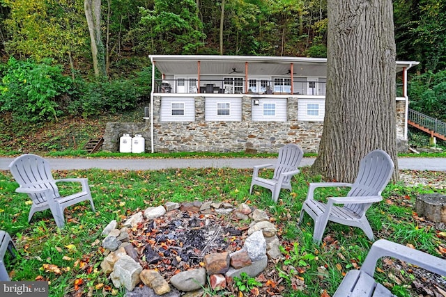 view of yard with an outdoor fire pit