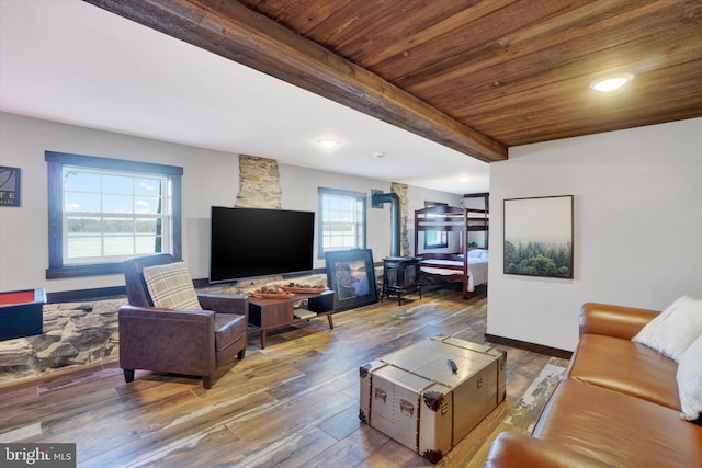 living room with beamed ceiling, hardwood / wood-style floors, and wood ceiling